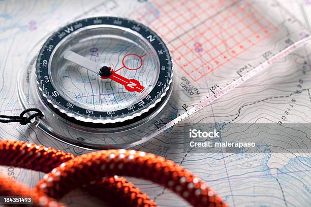 Compass On Topographic Maps Stock Photo - Download Image Now - Mountain Climbing, Navigational Compass, Map