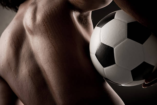Strong man with soccer ball