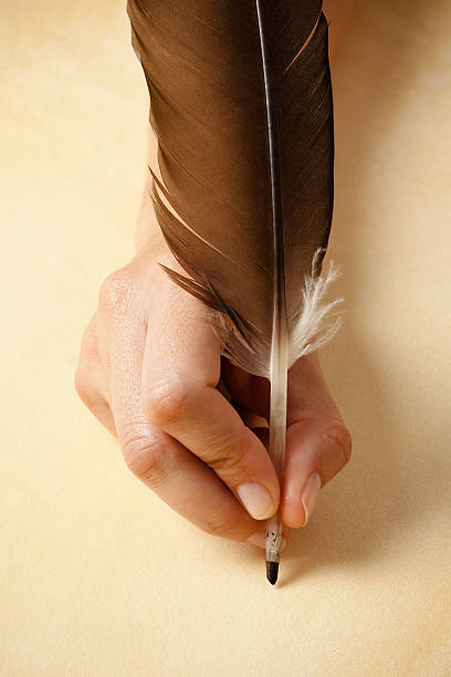 Writing with quill pen stock photo