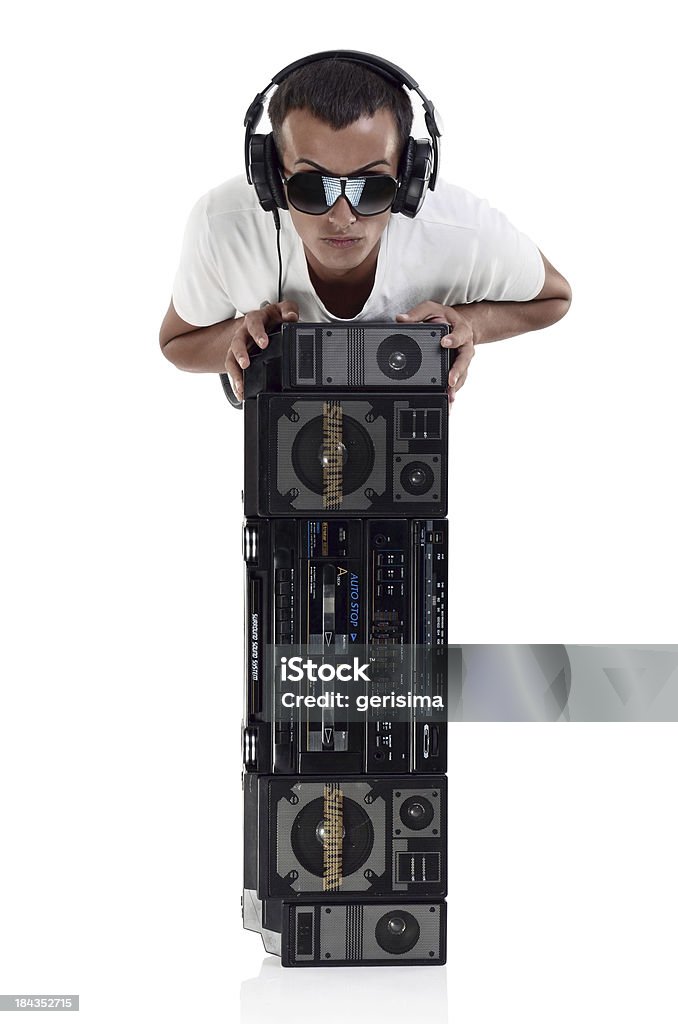 DJ with earphones and radio, clipping path Boy with earphones and radio listening music isolated on white with clipping path Boom Box Stock Photo