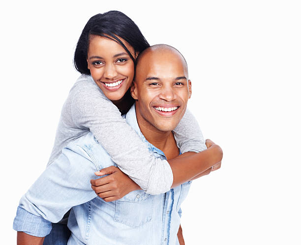 istock Playful couple enjoying piggyback ride 184352717