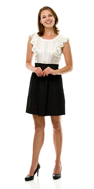 Happy Smiling Young Woman Standing Full Length Portrait Portrait of a woman on a white background. http://s3.amazonaws.com/drbimages/m/ls.jpg white shirt black skirt stock pictures, royalty-free photos & images