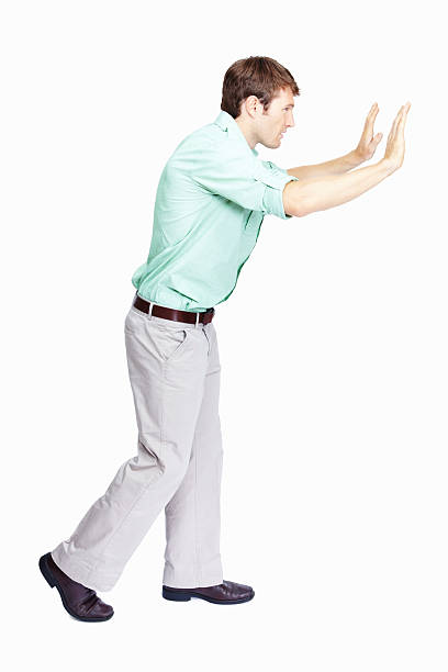 istock Male trying to push something 184354413