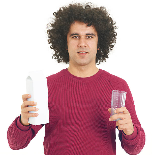 istock Young man holding a milk jug 184354807
