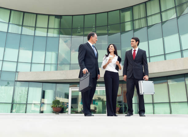 istock Business people talking outsite the office building 184354888