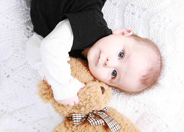 istock Baby Portrait with Teddy Bear in Studio 184355126