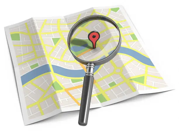 "3d render of a paper streetmap with magnifying glass over a location marker, isolated on a white background."