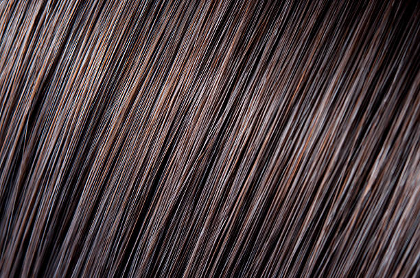 hair shine close-up of  hair strands with a beautiful shine.Related images: hair strands stock pictures, royalty-free photos & images