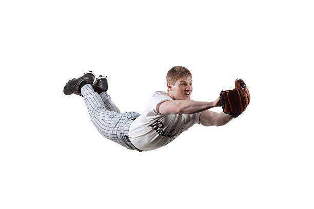 istock Baseball player diving to catch the ball 184355803