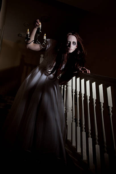 istock Ghost of a crazy woman creeping down the stairs 184355808