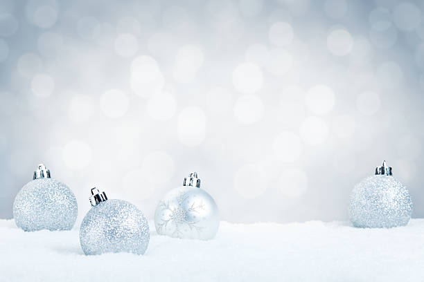 istock Silver Christmas baubles on snow with a silver background 184355911