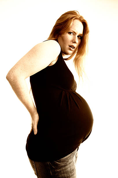 istock Pregnant young woman with back-ache 184356584