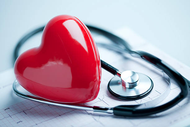 Heart, stethoscope and EKG stock photo