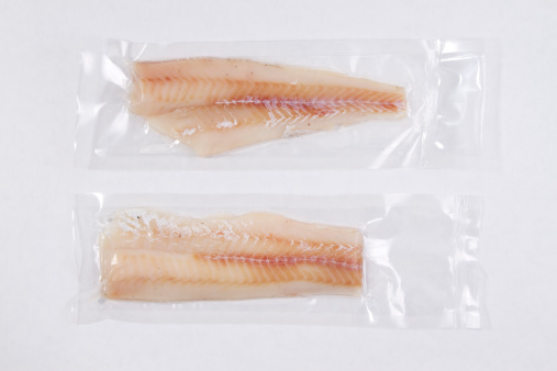Collection of packaged fish in shrink wrap.
