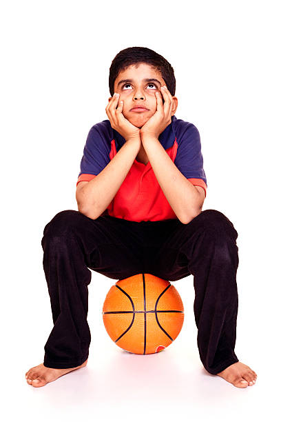 istock Isolated Indian Boy Sitting Sad Full Length Looking Up 184356898
