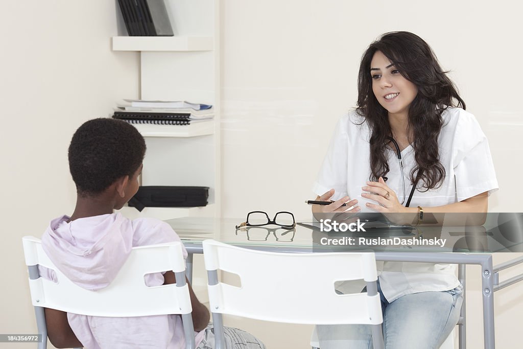 Patient child in doctor office. A patient child visiting in doctor office. Child Stock Photo