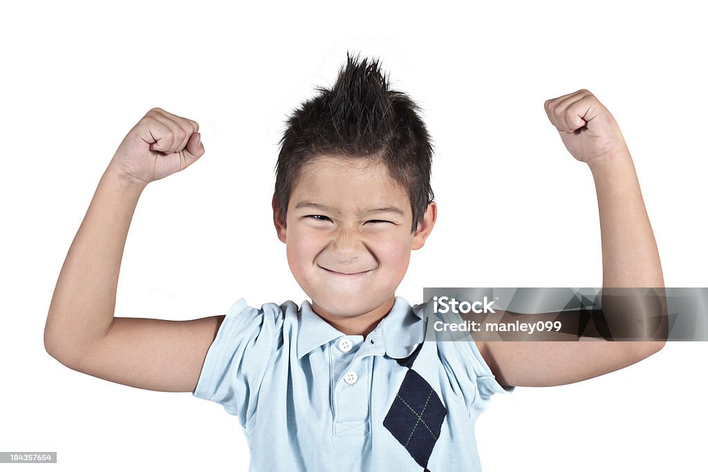 Little young boy flexión de sus armas y que una cara - Foto de stock de Alegre libre de derechos