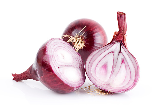 red onion, sliced in half, isolated on white. 