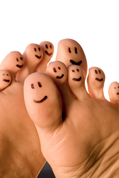 Happy Feet Smiling toes on white background. summer toes stock pictures, royalty-free photos & images