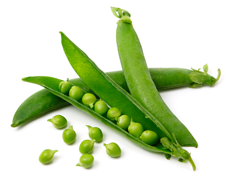 Fresh green peas on white background