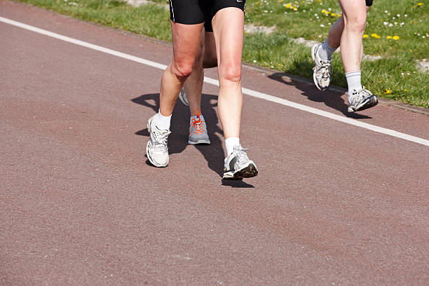 istock Joggers on fun run feet closeup 184359044