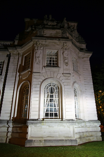 The windows of the Cardiff City Hall at night.