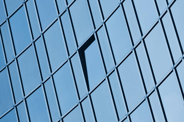 istock Glass office facade architecture blue toned 184359859