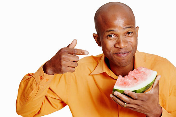 istock African American man pointing at watermelon 184360597
