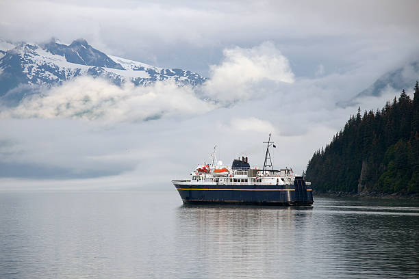 Alaska Marine Highway ferry ship leaving Valdez Harbor "Alaska Marine Highway ferry ship leaving Valdez Harbor, heading out to Prince William Sound waters." prince william sound photos stock pictures, royalty-free photos & images