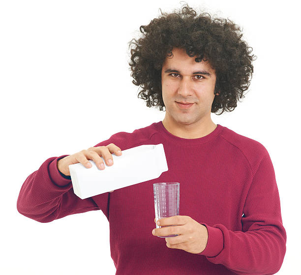 istock Young man holding a milk jug 184361123