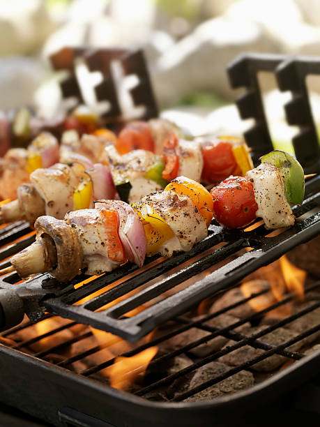 istock Chicken and Vegetable Kabobs on a Outdoor BBQ 184361144