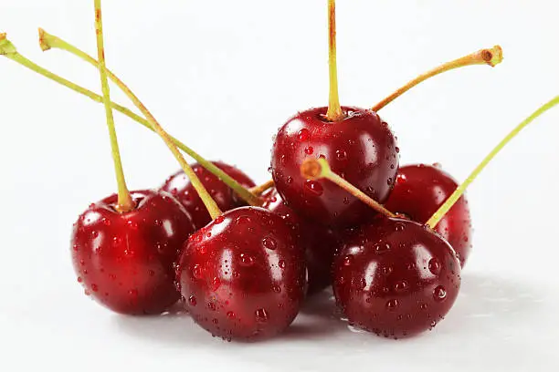 Sour cherries on white background