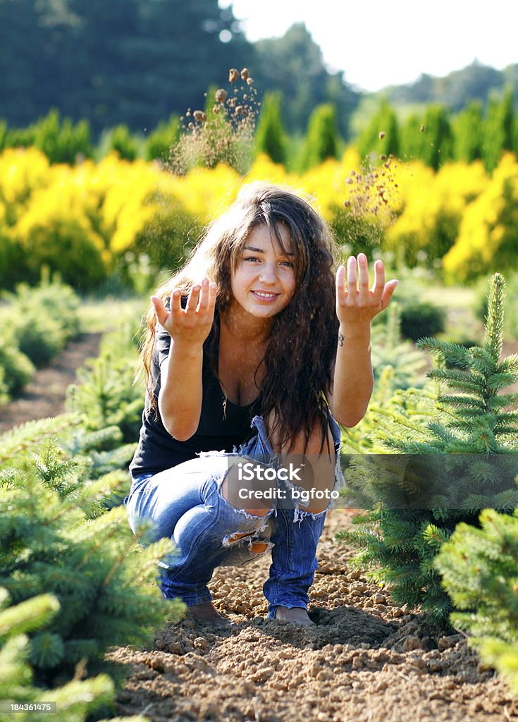 I Love Nature Woman throwing land in the air. Adult Stock Photo