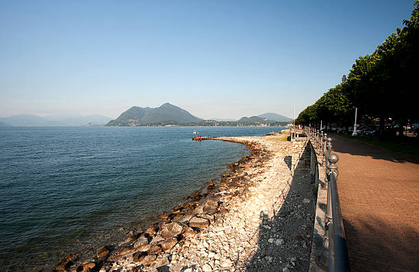 istock View of Lake Maggiore from the shore at sunset 184361486