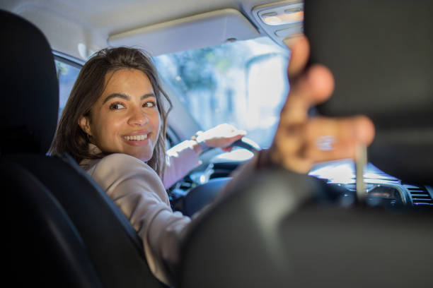 istock Young woman is driving a car 1843616128