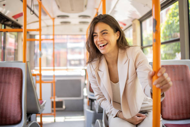 istock Happy young woman riding public transportation 1843616144
