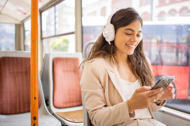 istock Happy young woman riding public transportation 1843616151