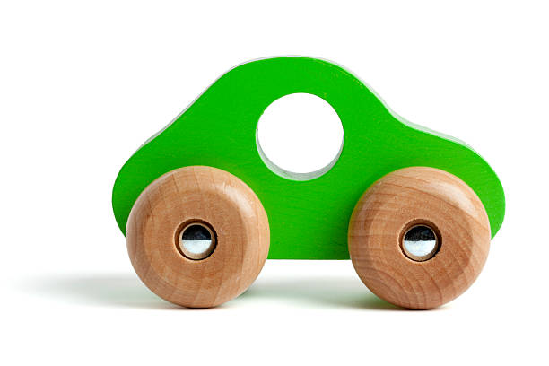 green wooden toy car - spielzeugauto stock-fotos und bilder