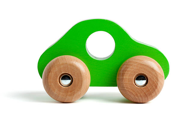 Green wooden toy car Green wooden toy car isolated on white. wooden car stock pictures, royalty-free photos & images