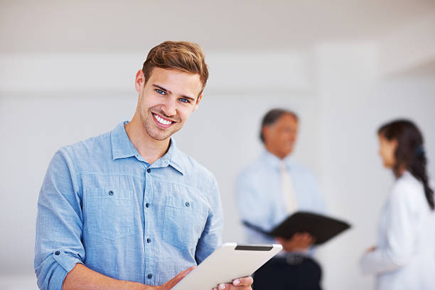 istock Young business man holding electronic tablet 184361677