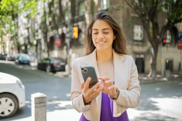 istock Happy young woman using phone 1843618761