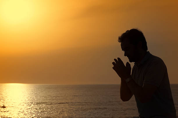 istock Silhouette of a man at sunset. 184361904