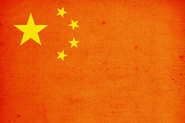 Close-up on a paper flag of China with light effect and vignette. Visible paper texture for super realistic effect. Selective focus. Canon 5D Mark II and Sigma lens.SEE MORE STATE FLAGS BELOW: