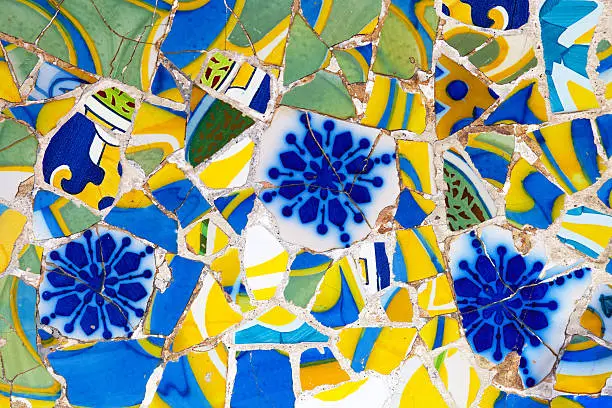 "Mosaic of broken tiles in the Parc Guell in Barcelona (Catalonia, Spain). The Parc Guell was designed by Antonio Gaudi and is declared as a World Heritage Site by the UNESCO.For more tiles and mosaics, please look here:"