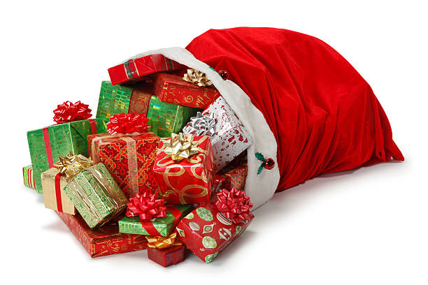 Santa bag full of Christmas presents Christmas presents spilling out of Santa Claus' red bag as it lies on it's side.  Photographed on white background in a studio setting. A clipping path is included. lying on side stock pictures, royalty-free photos & images