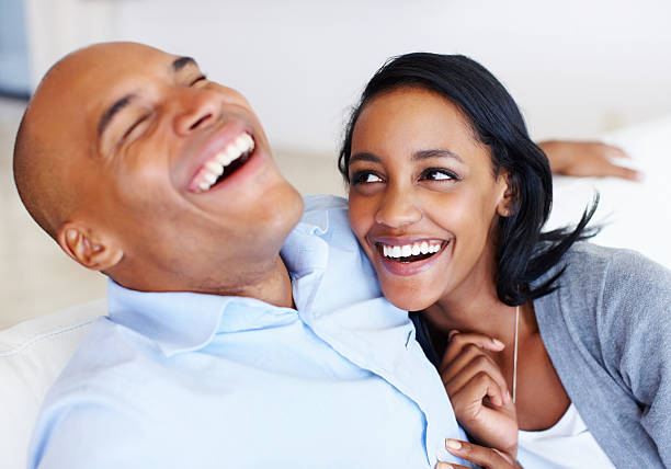 istock Cheerful couple laughing together 184362325