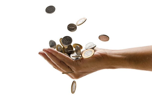 istock An outreached hand catching a pile of falling Euro coins 184362706
