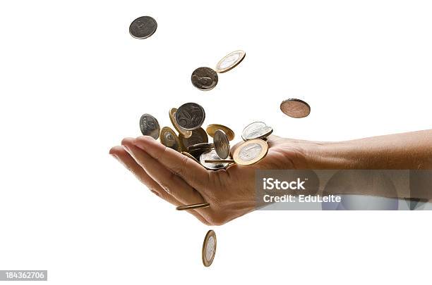 An Outreached Hand Catching A Pile Of Falling Euro Coins Stock Photo - Download Image Now
