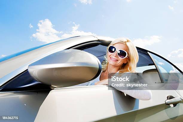 Woman Looks Through The Car Window During Road Trip Stock Photo - Download Image Now