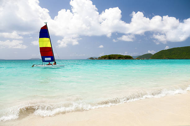 istock couple sailing a catamaran in the Caribbean 184362796